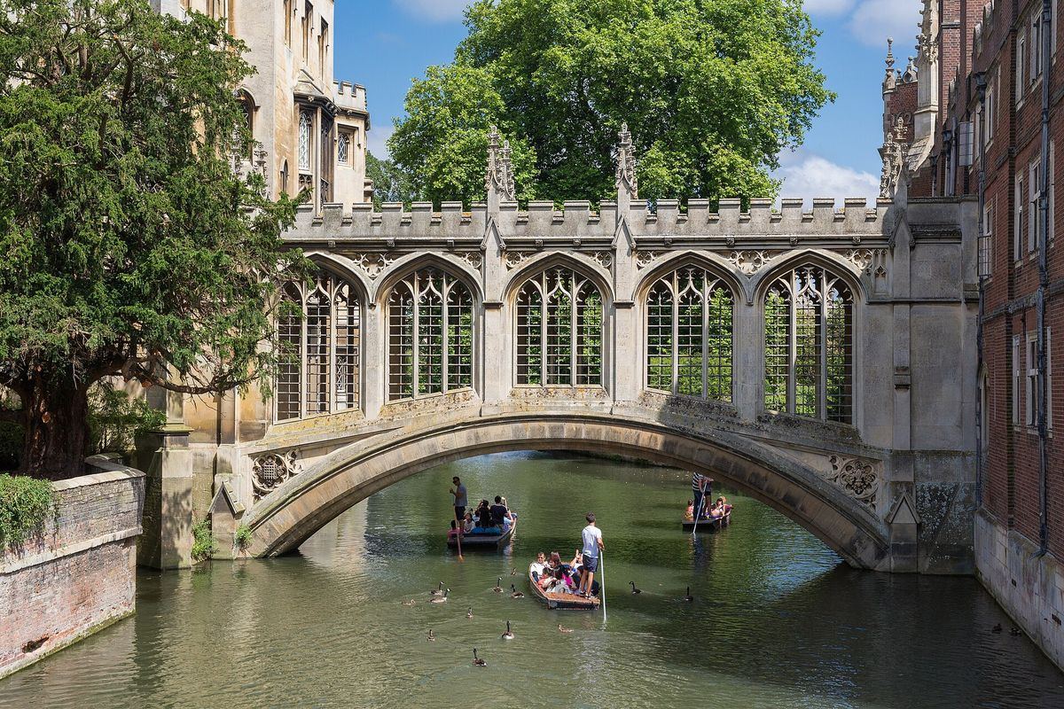The covered Gothic Revival Bridge of Sighs over the River Cam with punts passing underneath