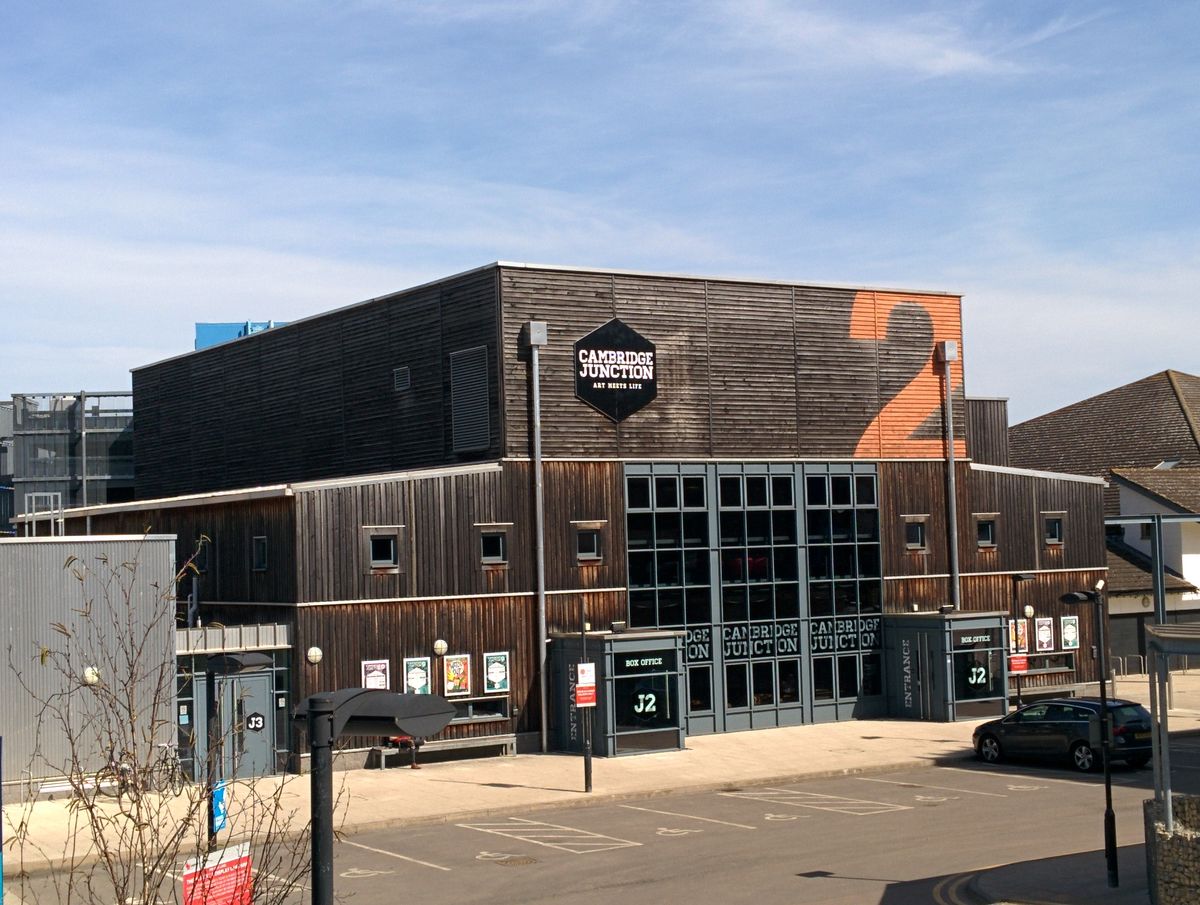 The timber-clad Cambridge Junction building with its illuminated sign