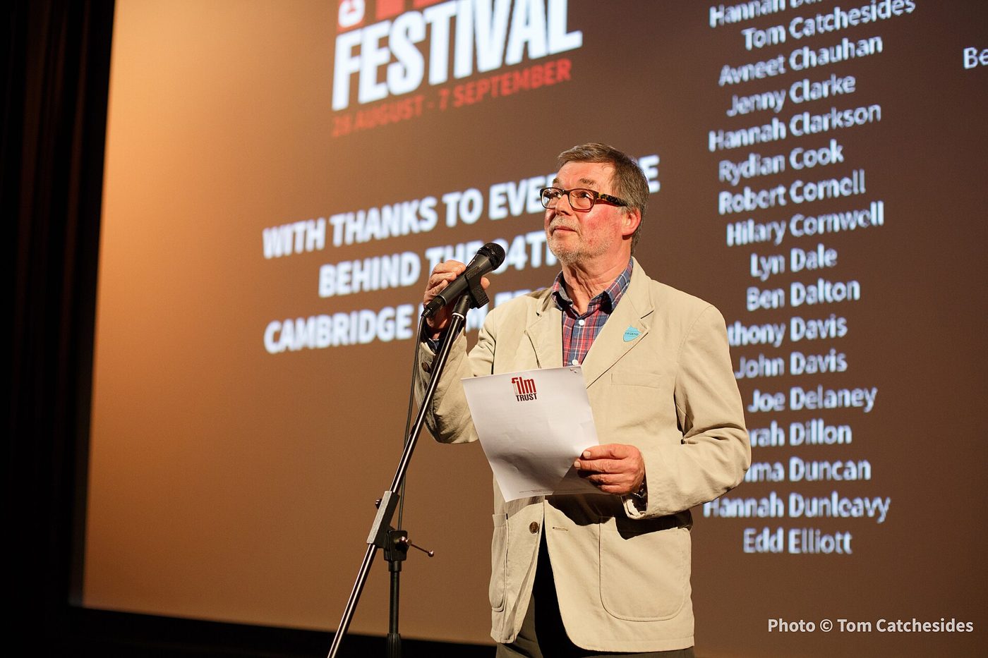Tony Jones speaking on stage on the closing night of the 2014 Cambridge Film Festival
