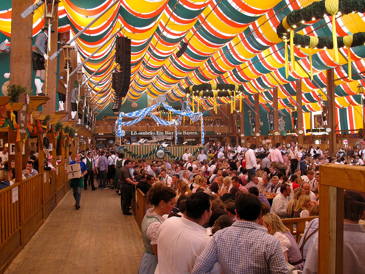 The painted front of a festival beer tent with flags