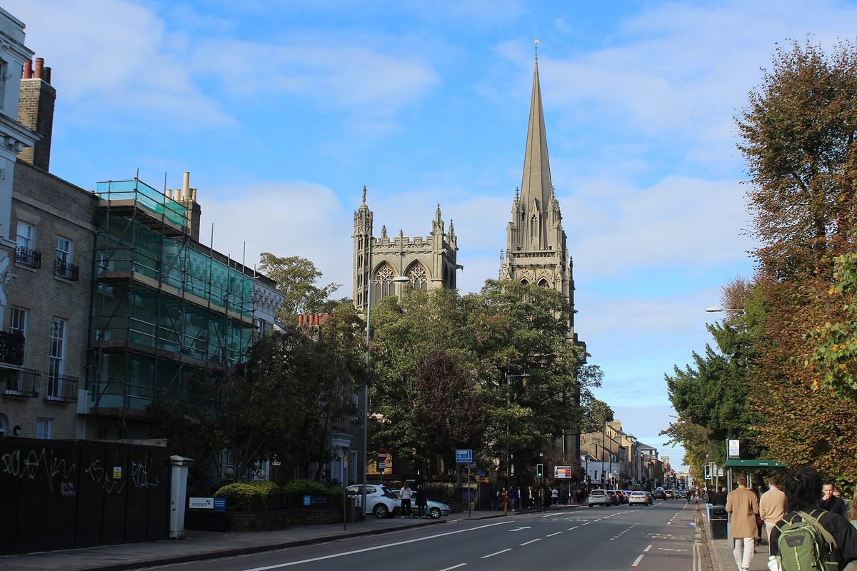 Hills Road leading towards the tall Gothic spire of Our Lady and the English Martyrs church
