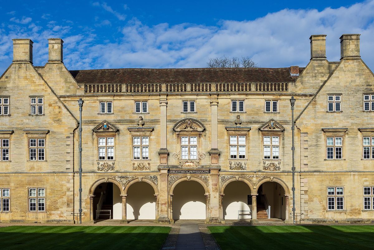The arcaded stone Pepys Building at Magdalene College across a lawn