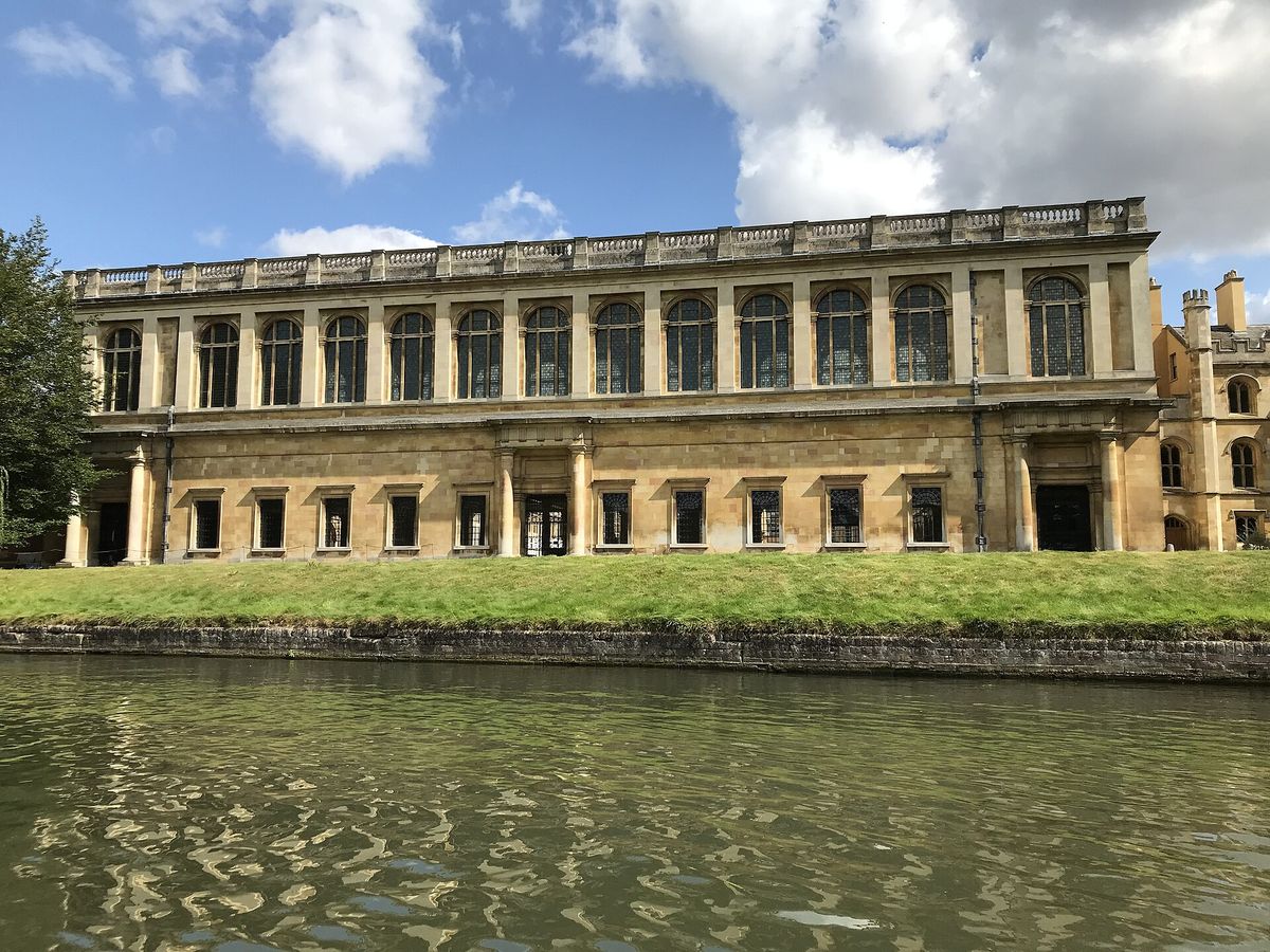 The Wren Library's long classical facade seen across the River Cam